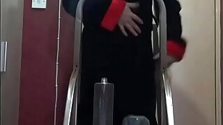 crossdressing bisexual sissy loves the taste of his own piss as he stands on a ladder pissing in a bottle