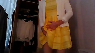 Bridesmaid crossdresser in cute yellow dress and white blazer